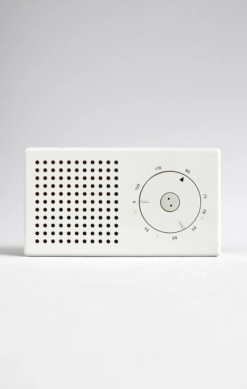 A white Braun pocket radio designed by Dieter Rams